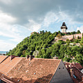 Houses In Town Against Schlossberg And Cloudy Sky